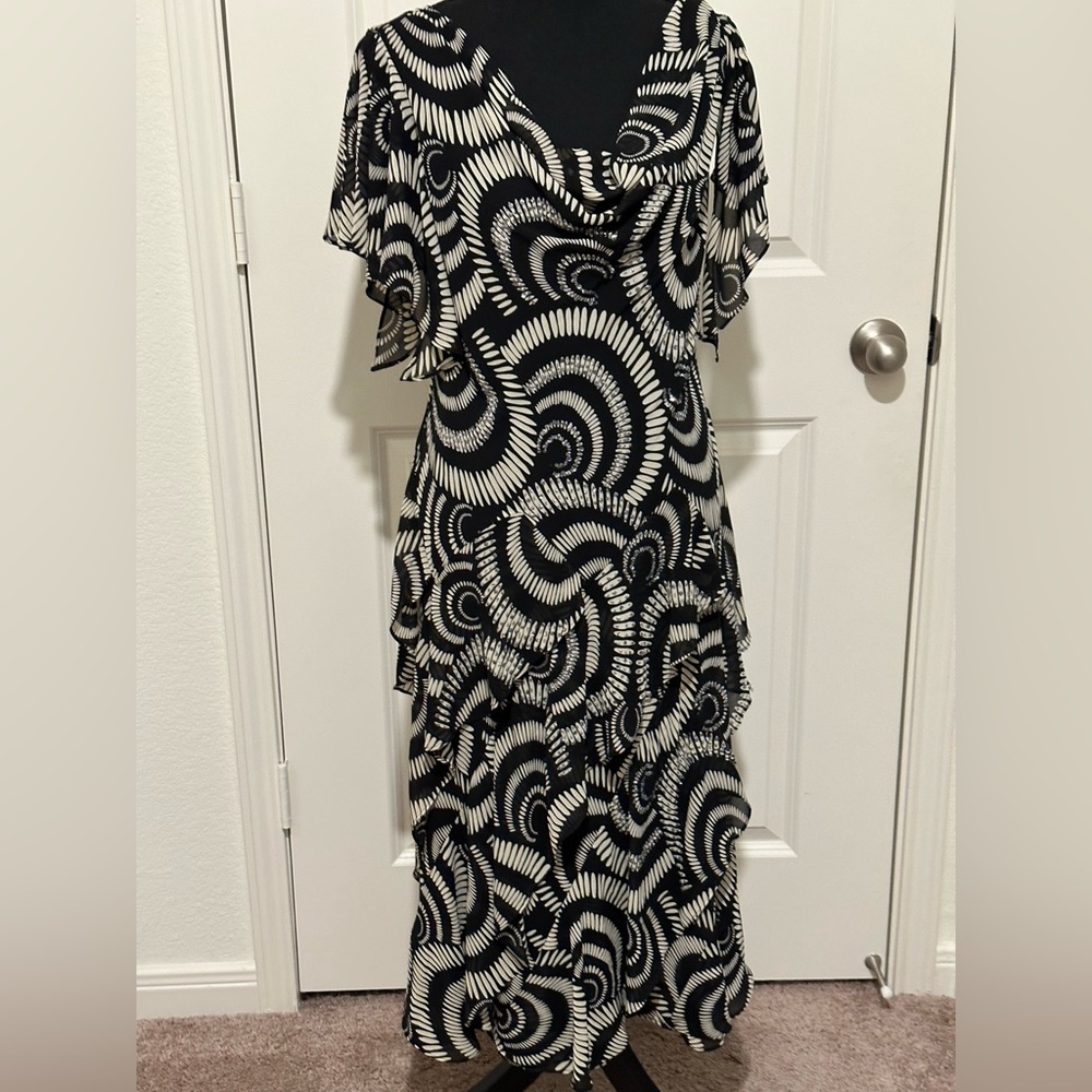 Signature by Robbie Bee lined ruffled dress with sequins sewn throughout dress.